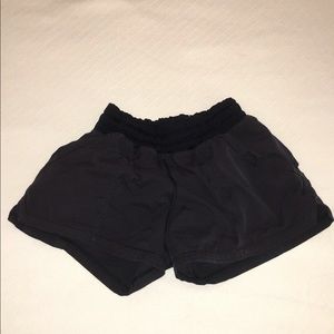 Black boxy lululemon shorts.